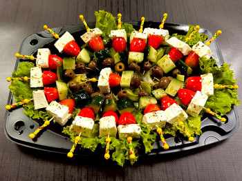Platter of 20 pieces of feta sticks with cherry tomatoes, cucumber and olives 